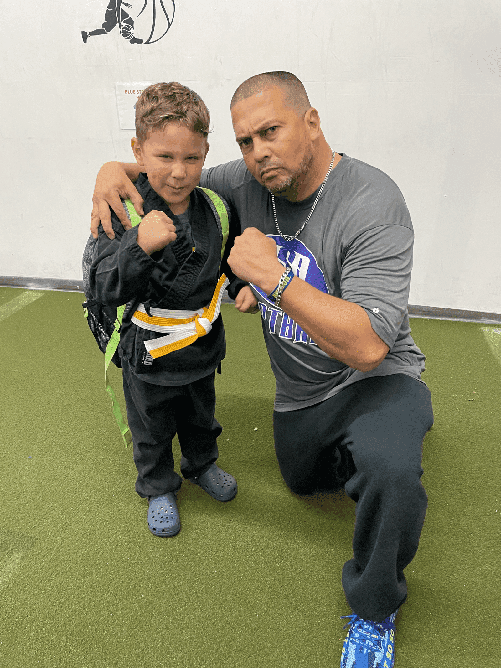A Gallo 8 Gym coach training with a young member